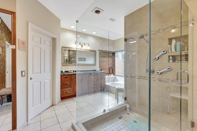 bathroom featuring a garden tub, tile patterned flooring, a stall shower, vanity, and recessed lighting