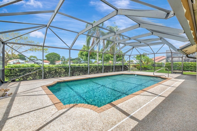 outdoor pool with a patio and a lanai
