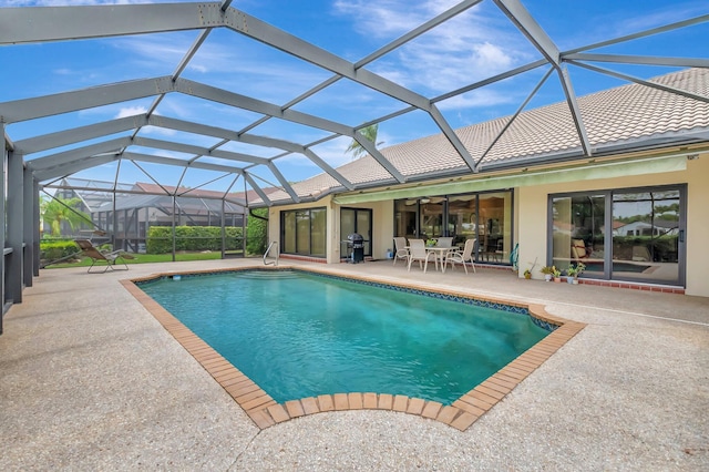outdoor pool with area for grilling, a patio, ceiling fan, and glass enclosure