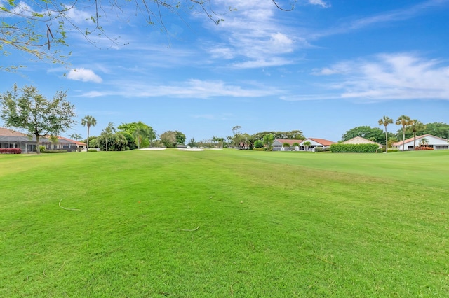 view of yard featuring a residential view and golf course view