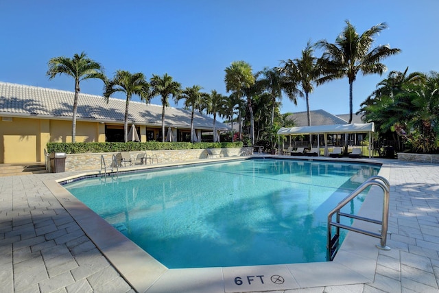 community pool with a patio area