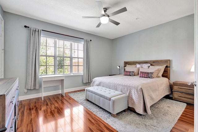 112 Osceola Ln, Jupiter, FL 33458 - bedroom with baseboards, ceiling fan, and wood finished floors