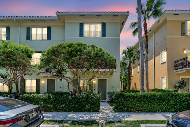 112 Osceola Ln, Jupiter, FL 33458 - mediterranean / spanish-style home with a tiled roof and stucco siding