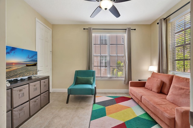 112 Osceola Ln, Jupiter, FL 33458 - living area featuring baseboards, ceiling fan, and a healthy amount of sunlight