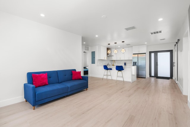 303/305 De Carie, Delray Beach, FL 33444 - living room featuring recessed lighting, visible vents, and light wood-type flooring