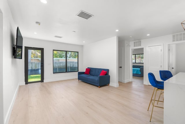 303/305 De Carie, Delray Beach, FL 33444 - living area with recessed lighting, visible vents, and light wood-type flooring