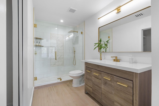 303/305 De Carie, Delray Beach, FL 33444 - full bath featuring visible vents, wood finished floors, toilet, and vanity