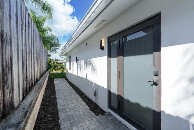 303/305 De Carie, Delray Beach, FL 33444 - view of property exterior featuring stucco siding