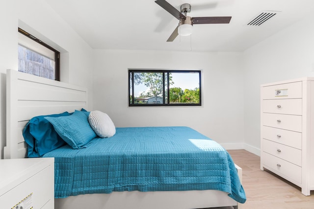 303/305 De Carie, Delray Beach, FL 33444 - bedroom featuring baseboards, a ceiling fan, light wood finished floors, and visible vents