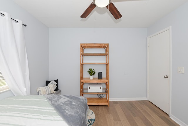 1831 SW Notre Dame Ave, Port Saint Lucie, FL 34953 - bedroom featuring wood finished floors, ceiling fan, and baseboards