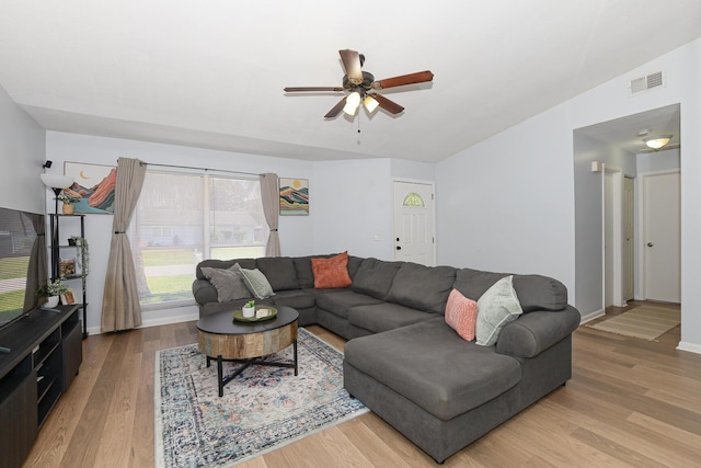 1831 SW Notre Dame Ave, Port Saint Lucie, FL 34953 - living room featuring a ceiling fan, wood finished floors, and baseboards