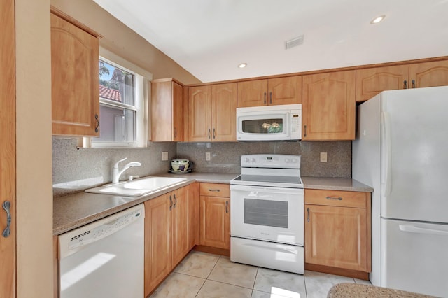 kitchen featuring a sink, light tile patterned flooring, white appliances, and backsplash