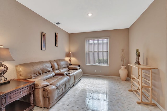 living room with baseboards and visible vents