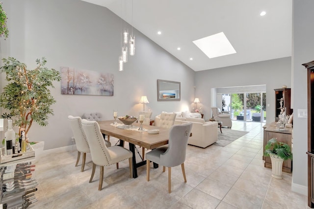 dining room with a skylight, high vaulted ceiling, light tile patterned floors, and recessed lighting
