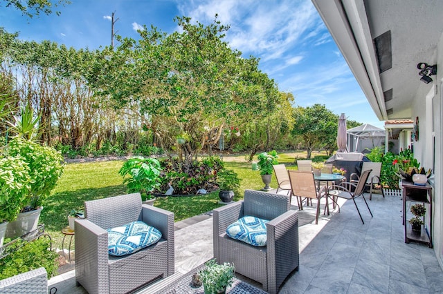 view of patio with an outdoor living space and outdoor dining space