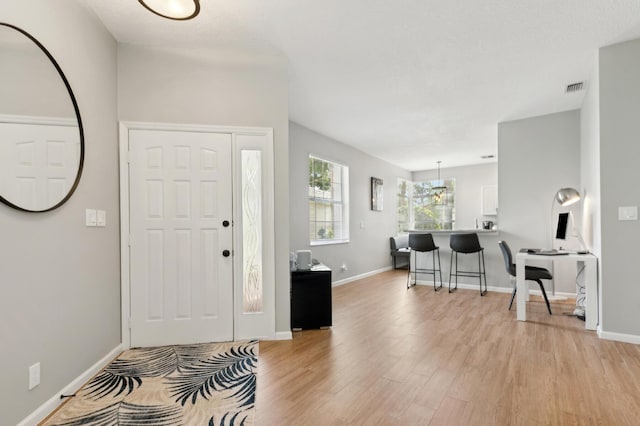 175 Harbor Lake Cir, Greenacres, FL 33413 - entrance foyer featuring baseboards, visible vents, and light wood-style floors
