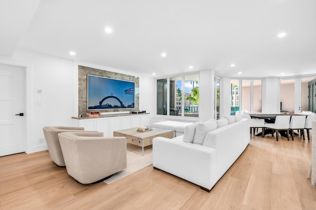 living room featuring recessed lighting and light wood-style flooring