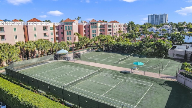 view of sport court featuring fence