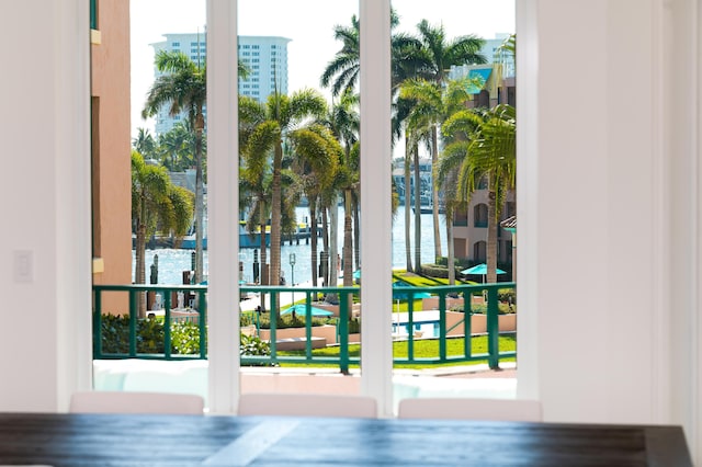 doorway with plenty of natural light and a water view