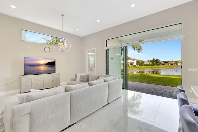 living area with recessed lighting, baseboards, and a notable chandelier