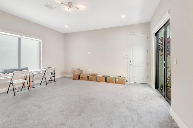 interior space featuring carpet floors, recessed lighting, baseboards, and visible vents