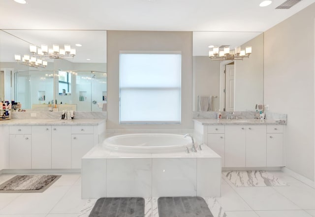 full bath with a notable chandelier, a sink, plenty of natural light, a bath, and a stall shower