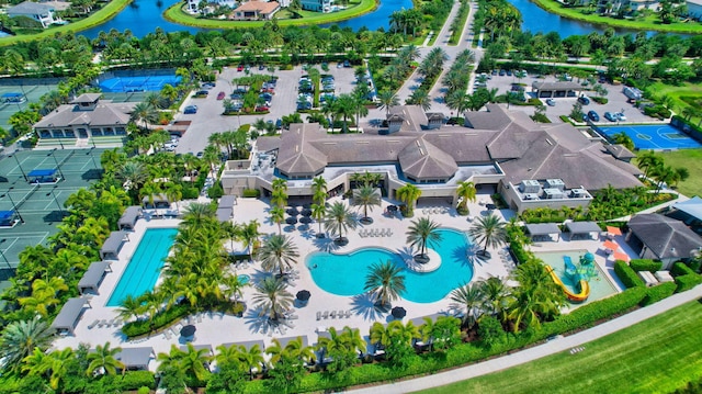 birds eye view of property with a residential view and a water view