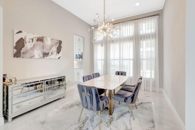dining space featuring baseboards, marble finish floor, and a notable chandelier