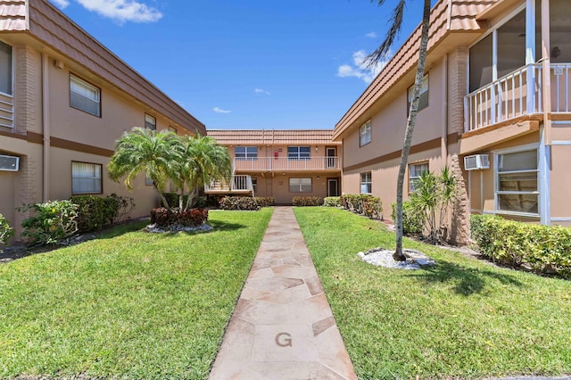 view of home's community featuring a lawn