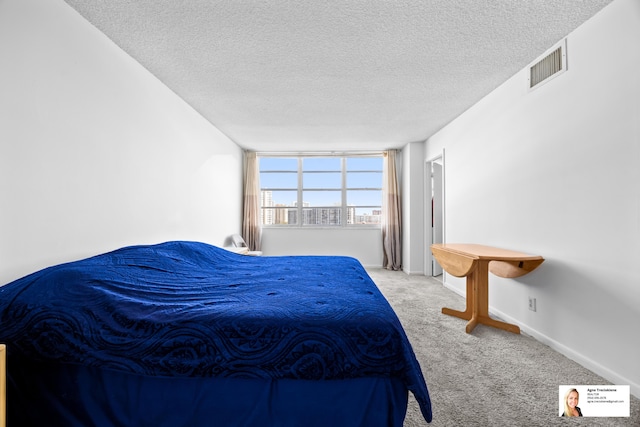 137 Golden Isles Dr Unit 806, Hallandale Beach, FL 33009 - carpeted bedroom featuring a textured ceiling and baseboards