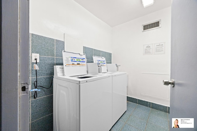 137 Golden Isles Dr Unit 806, Hallandale Beach, FL 33009 - communal laundry room featuring washing machine and dryer and baseboards