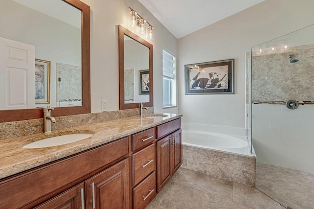 bathroom with a sink, a tile shower, and a garden tub