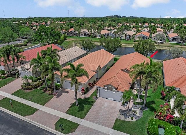 aerial view with a residential view and a water view