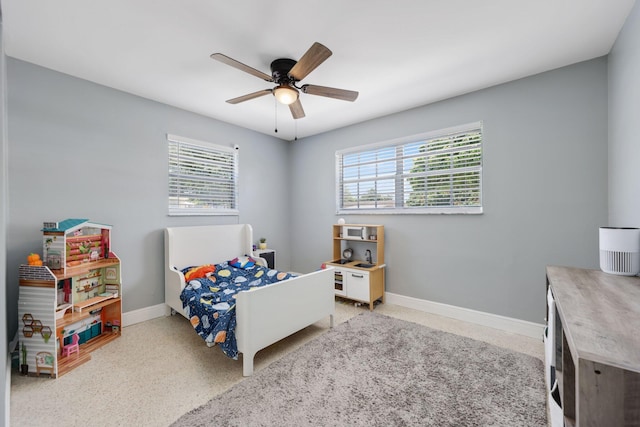 2136 W Carrol Cir, West Palm Beach, FL 33415 - bedroom with multiple windows, baseboards, and ceiling fan