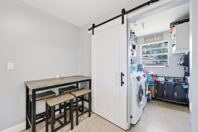 2136 W Carrol Cir, West Palm Beach, FL 33415 - washroom with a barn door and washer and dryer