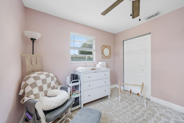 2136 W Carrol Cir, West Palm Beach, FL 33415 - sitting room with a ceiling fan, light carpet, and baseboards