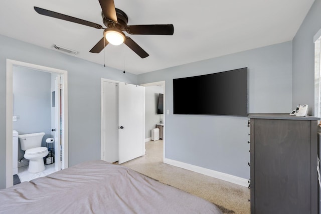 2136 W Carrol Cir, West Palm Beach, FL 33415 - bedroom with baseboards, ceiling fan, and connected bathroom
