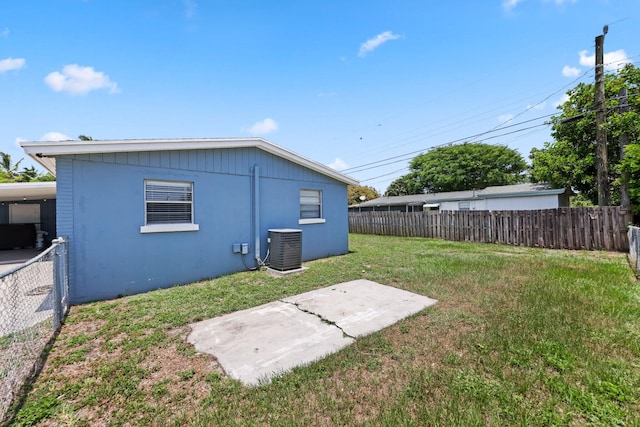 2136 W Carrol Cir, West Palm Beach, FL 33415 - rear view of property with cooling unit