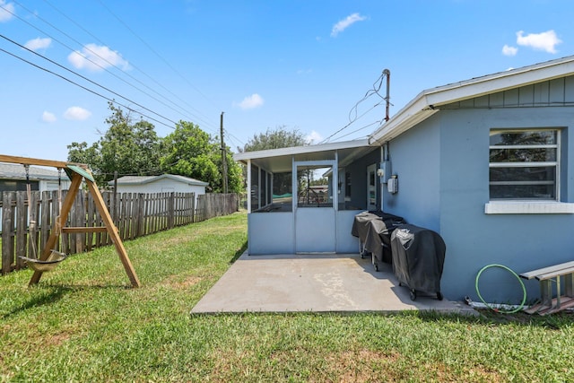 2136 W Carrol Cir, West Palm Beach, FL 33415 - view of yard with a sunroom and a patio