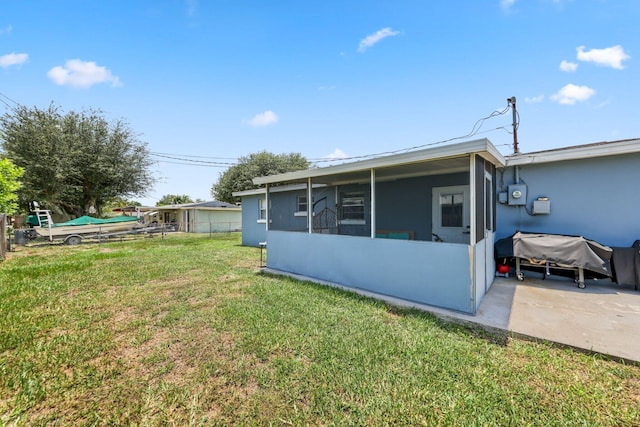 2136 W Carrol Cir, West Palm Beach, FL 33415 - rear view of house featuring a sunroom
