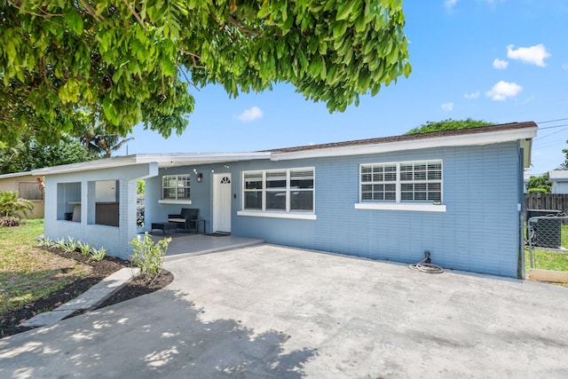 2136 W Carrol Cir, West Palm Beach, FL 33415 - ranch-style home featuring a patio area