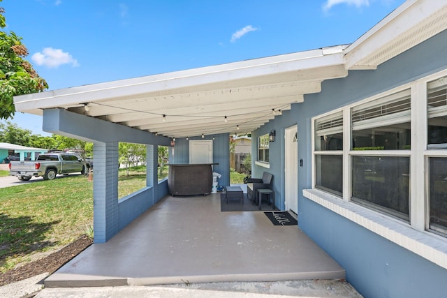 2136 W Carrol Cir, West Palm Beach, FL 33415 - view of patio / terrace with an attached carport