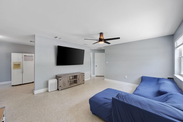 2136 W Carrol Cir, West Palm Beach, FL 33415 - living area featuring baseboards, ceiling fan, and speckled floor