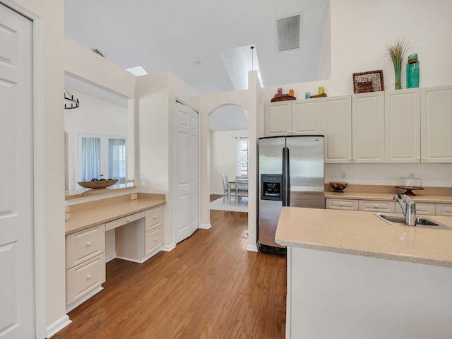 8465 Mandarin Blvd, Loxahatchee, FL 33470 - kitchen with a sink, light wood finished floors, stainless steel refrigerator with ice dispenser, and visible vents