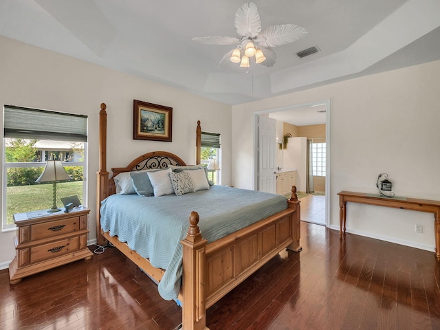 8465 Mandarin Blvd, Loxahatchee, FL 33470 - bedroom with visible vents, baseboards, a raised ceiling, hardwood / wood-style flooring, and a ceiling fan