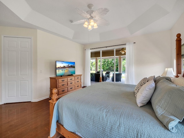 8465 Mandarin Blvd, Loxahatchee, FL 33470 - bedroom featuring access to outside, ceiling fan, a raised ceiling, baseboards, and wood finished floors