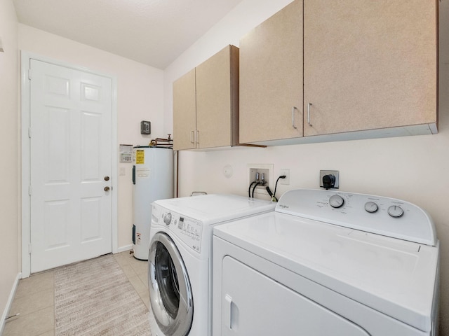 8465 Mandarin Blvd, Loxahatchee, FL 33470 - laundry area with independent washer and dryer, cabinet space, baseboards, water heater, and light tile patterned flooring