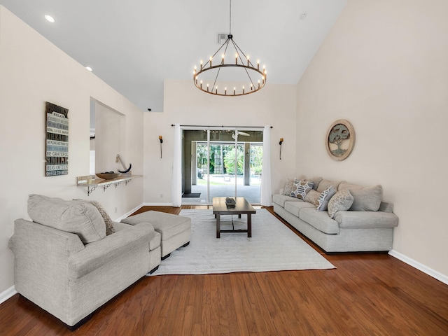 8465 Mandarin Blvd, Loxahatchee, FL 33470 - living room with baseboards, wood finished floors, and a notable chandelier