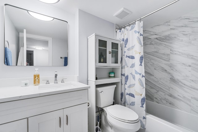 bathroom featuring vanity, shower / bath combo, visible vents, and toilet