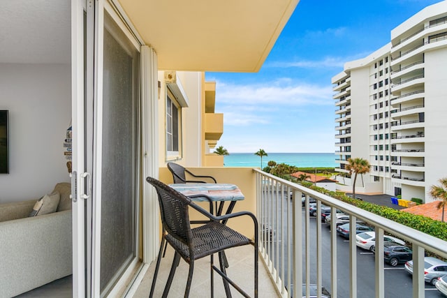 balcony featuring a water view
